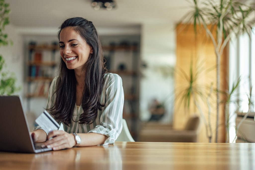 Excited caucasian woman, looking at her bank balance